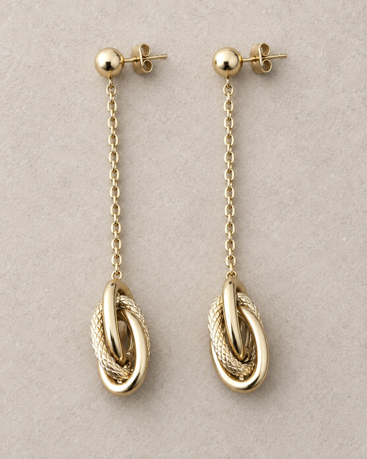 Boucles d’oreilles LIEN dorées en acier inoxydable